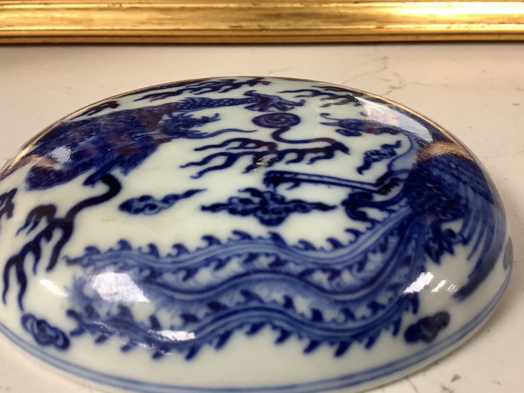 A Chinese underglaze copper red vase and a Chinese blue and white ‘dragon’ box and cover, tallest 15cm